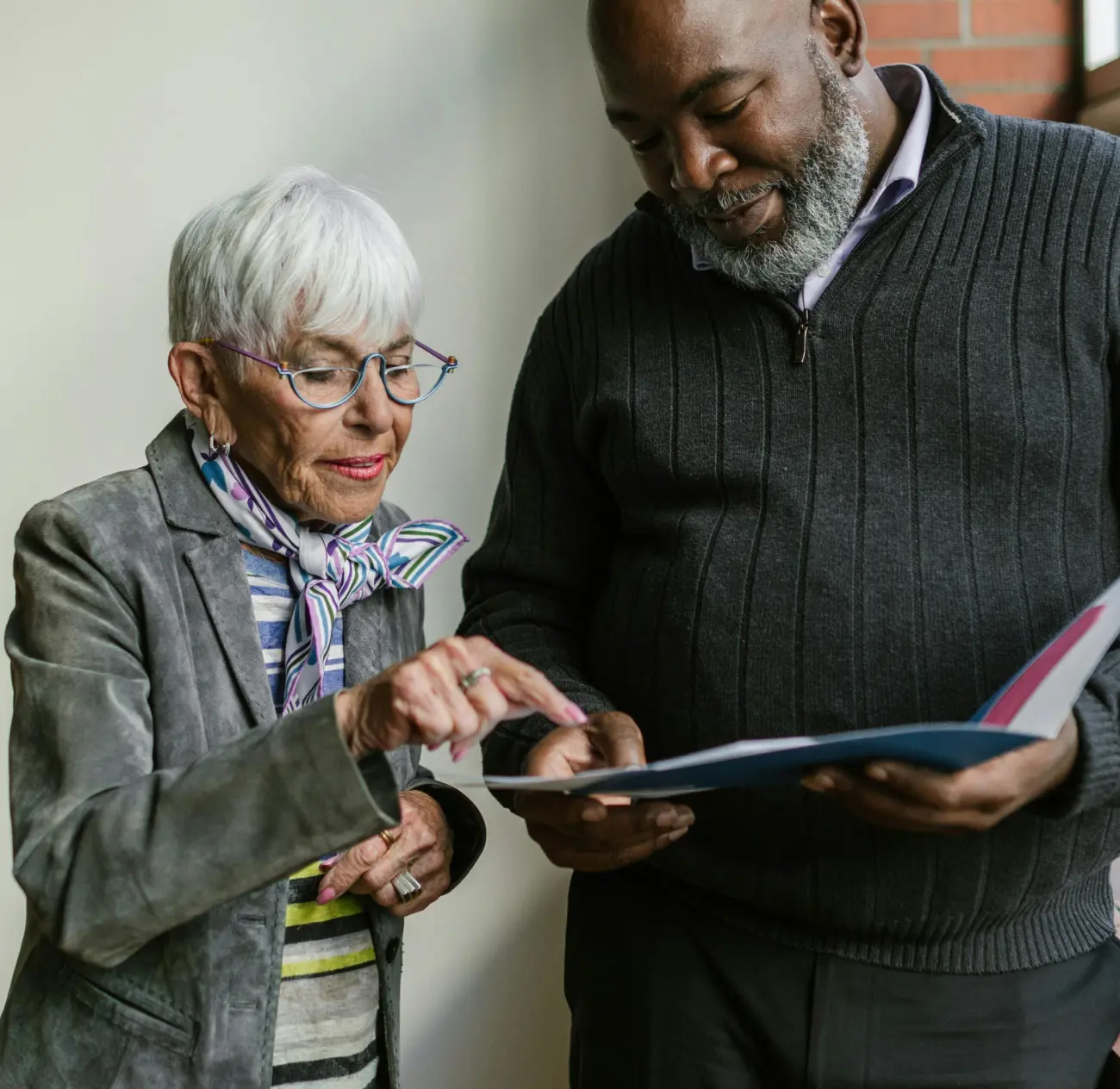 Man and woman checking report